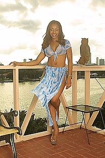Big boobed black babe posing on her balcony outside