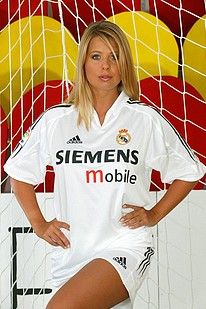 Tanned blonde soccer fan showing off her sporty body