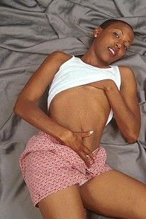 Small breasted black amateur posing naked on her bed