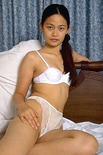 Pics of an Asian teen nympho masturbating in her bedroom