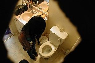 Cute girl captured on the toliet by a secret camera