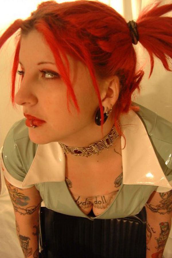 Pigtailed punk rock hottie with red hair showing off her ink - Punk Rock Girlfriend