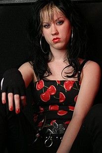 Corset wearing goth girl stripping and posing - Punk Rock Girlfriend