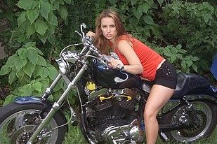 Long haired biker babe gets hot and gets herself off