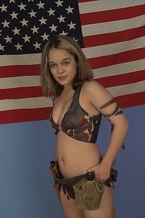Camo wearing cutie getting naked in front of the flag
