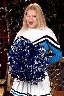 Gap toothed blonde cheerleader stripping and posing