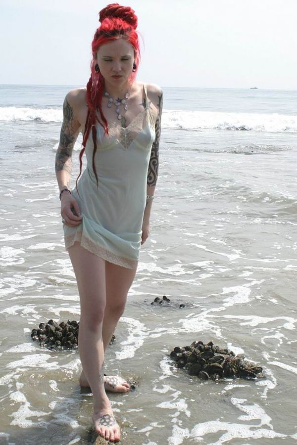 Inked up goth girl playing in the waves at a beach - Punk Rock Girlfriend