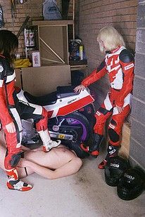Motorbike loving women enjoying playtime with their slave