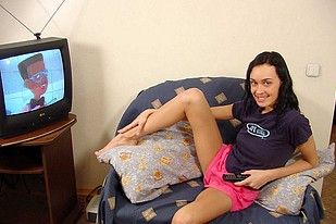 Cute brunette with a nice rack masturbating on her sofa