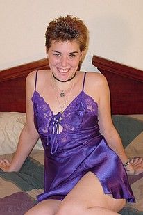 Small breasted amateur in purple lingerie strips and poses